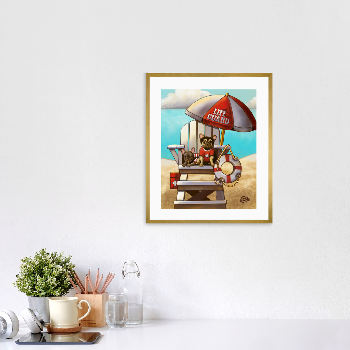 Caution Lifeguards on Duty vertical giclée print, 11x14, in a gold frame, 14x17 approximate, on a wall above a white desk.