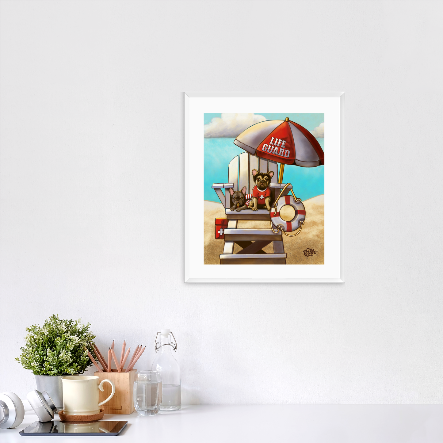 Caution Lifeguards on Duty vertical giclée print, 11x14, in a white frame, 14x17 approximate, on a wall above a white desk.
