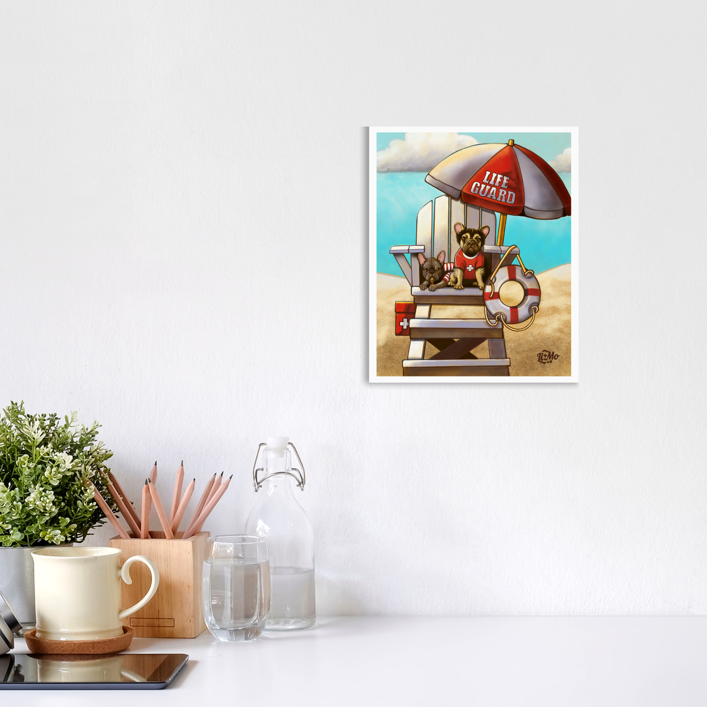 Caution Lifeguards on Duty giclée print, 8x10, framed on a wall above a white desk with a mug and plant. Illustration is displayed in a vertical format.