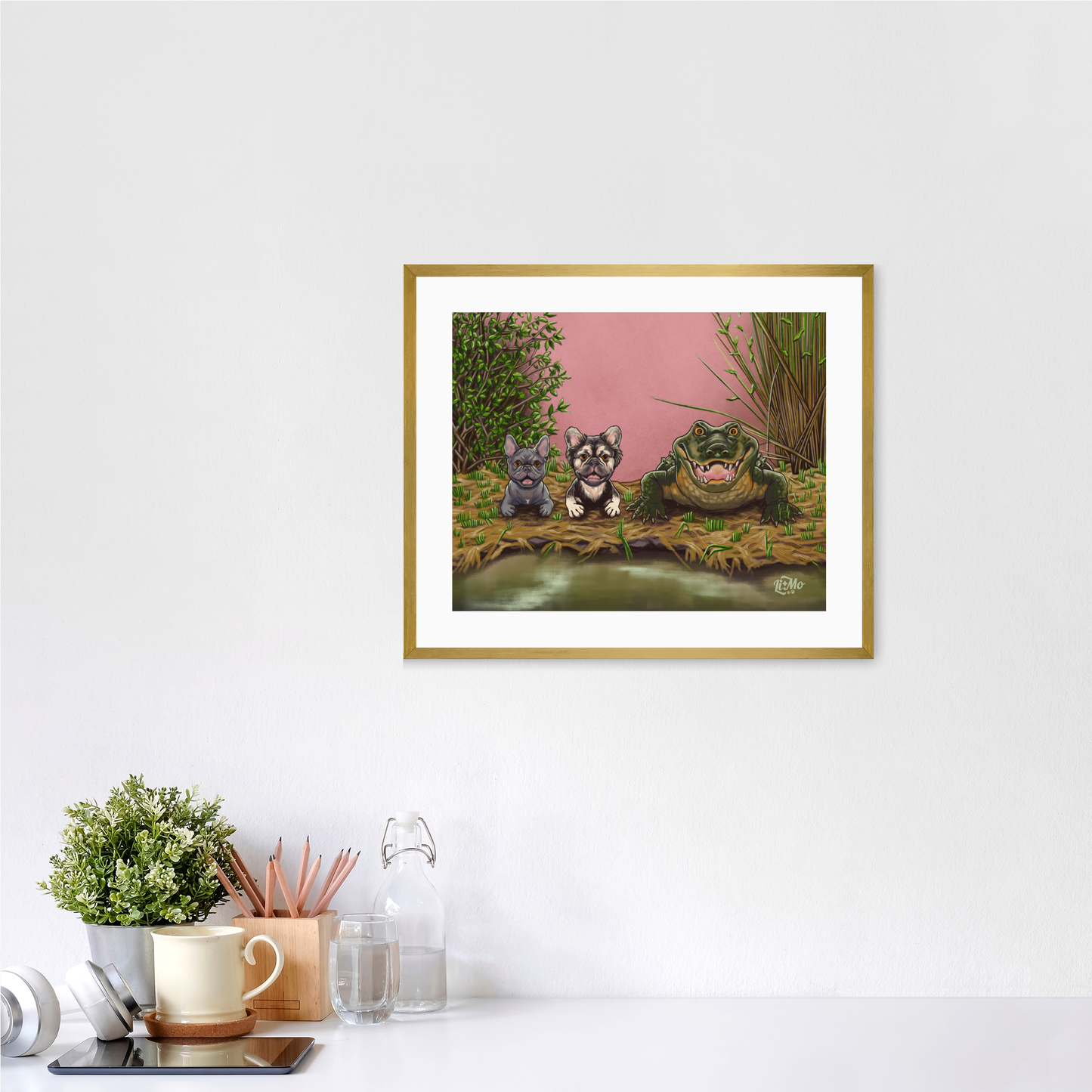 Feeling Snappy horizontal giclée print, 11x14, in a gold frame, 14x17 approximate, on a wall above a white desk.